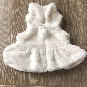 White fur zip vest